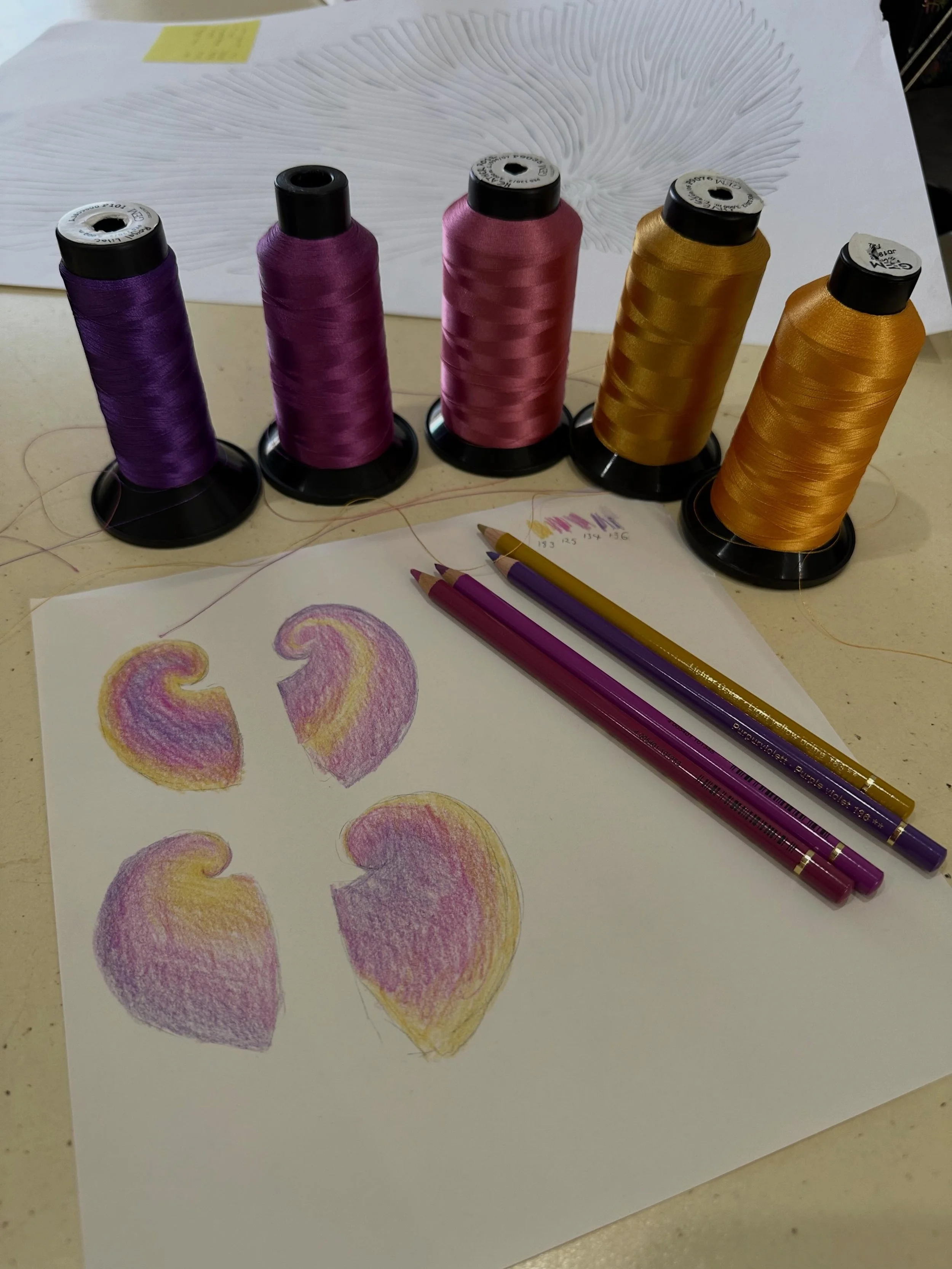 Choosing thread colours for a piece is one thing.  Deciding how to apply those colours to the piece is something entirely different. 

When deciding upon colour placement I find quick little coloured pencil sketches are really helpful to visualise my