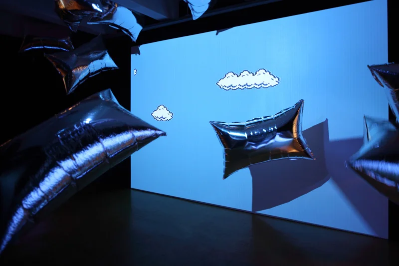 Andy Warhol's Silver Clouds with Cory Arcangel's Mario Clouds at the Warhol Museum in Pittsburgh. Image courtesy coryarcangel.com. 