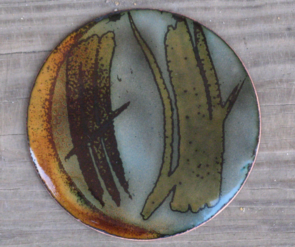 Copper, Enamel, fire scale design, 4 inch diameter.