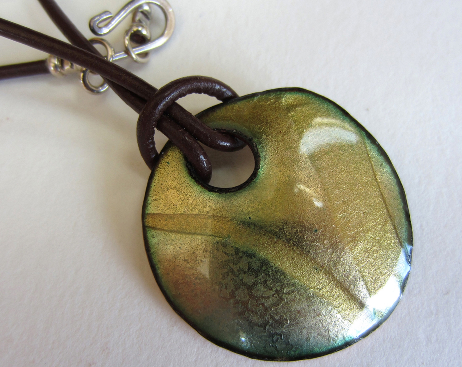 Enamel on copper, 1 1/4 inches organic shape.
