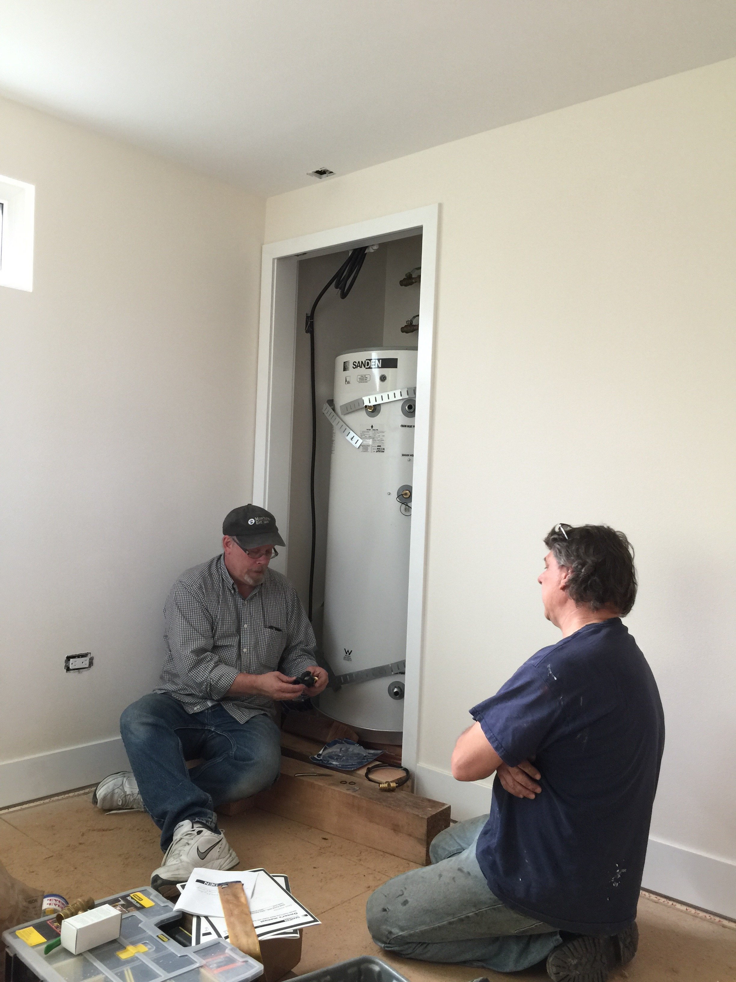 Mark Jerome and Jon Anway of JonCin Plumbing works on installing the system and monitoring