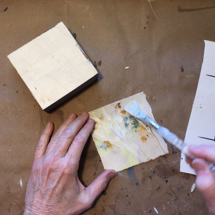 Apply Golden Matte Medium to board and back of paper artist Carol Ann Webster
