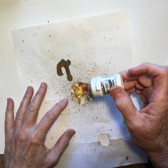 Sprinkle Brusho crystals through mask artist Carol Ann Webster