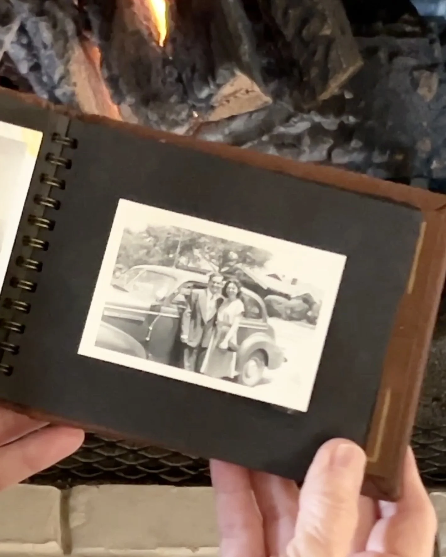 Jimmy and Estella by a car