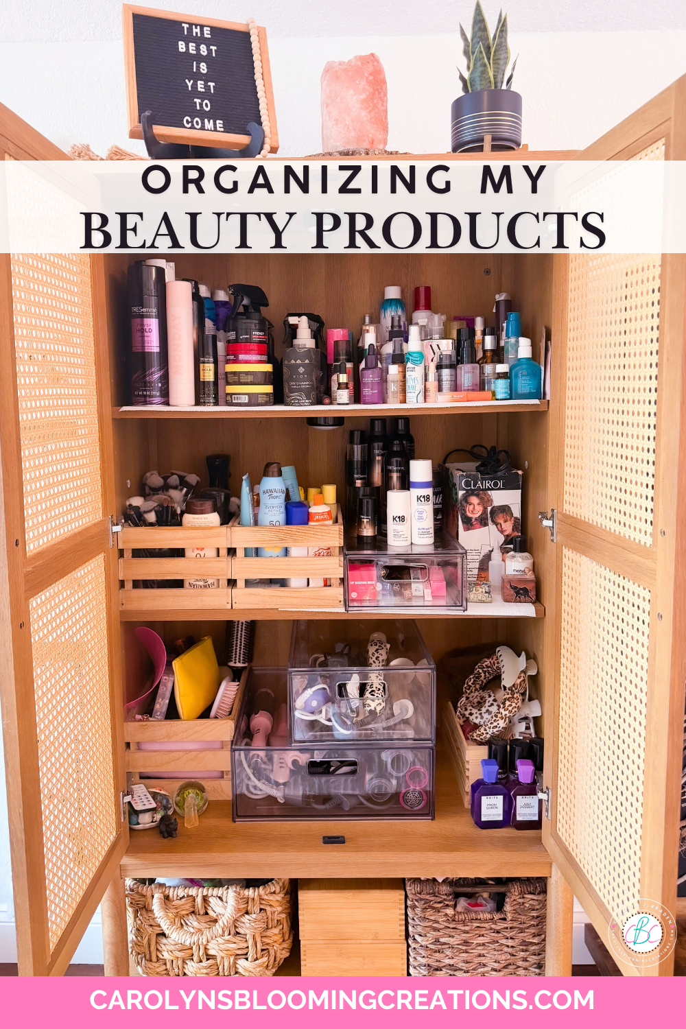 Clear drawer organizers holding hair styling tools inside a beauty storage cabinet.