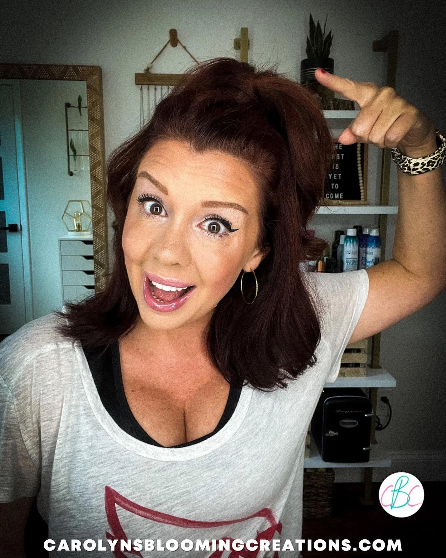 I was a cheerleader from age 8-18 (and a dancer before that) and I got really used to wearing my hair up with a bow. 

While bows are still a cute way to cover a ponytail holder, I love trying other styles too. 

This easy DIY hair wrap has been my g