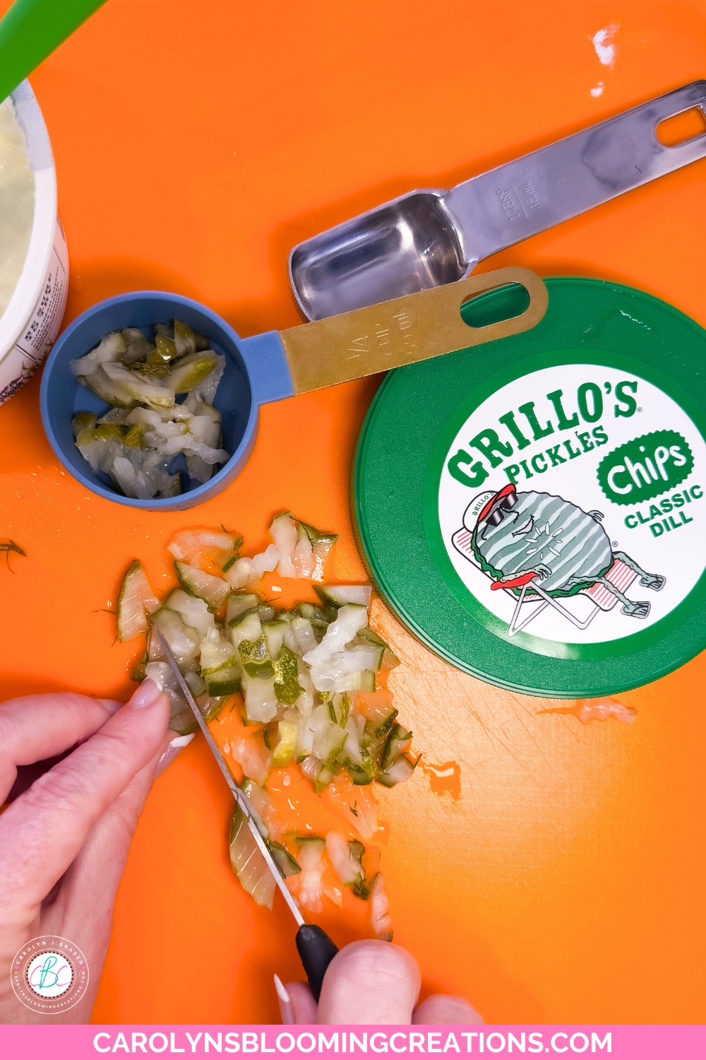 chopping dill pickles for a dip