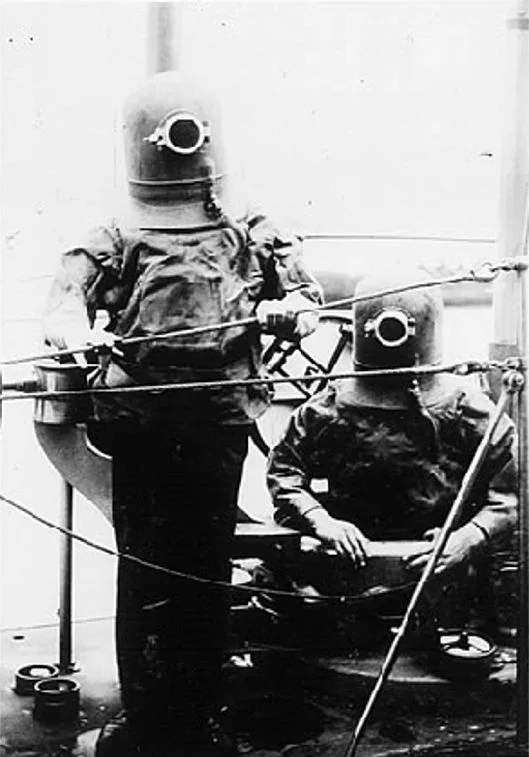 Two men wearing suits for escape purposes 1908.