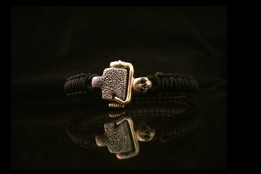 woven bracelet w skull & blk diamond eyes.jpg