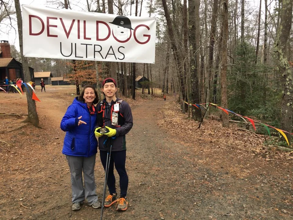 Showing off my belt buckle after finishing my first 100-mile race.