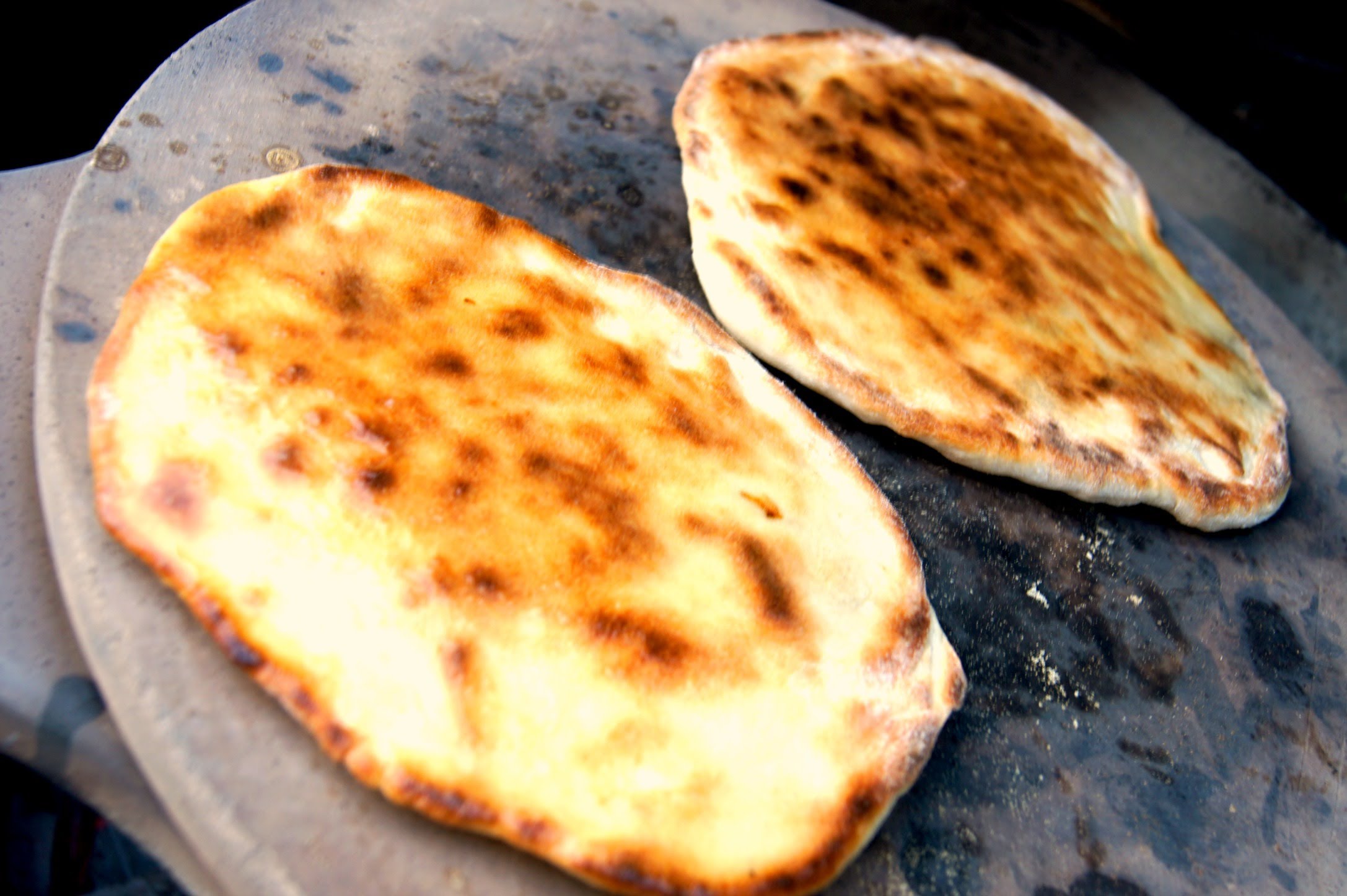 Baking naan in a Tandur oven.