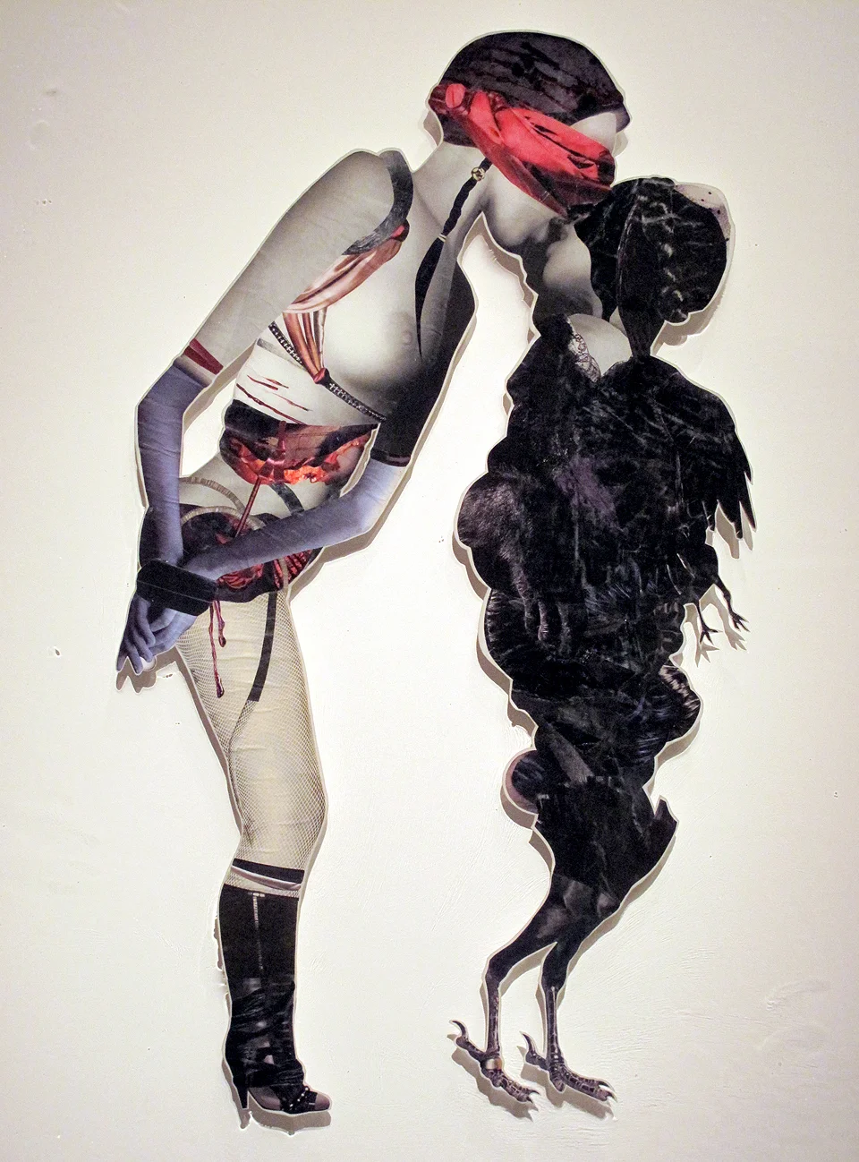 Lip Locked, 2011, Hand-cut and assembled photographs and found images, cast in plastic resin. Framed. 28 x 38"