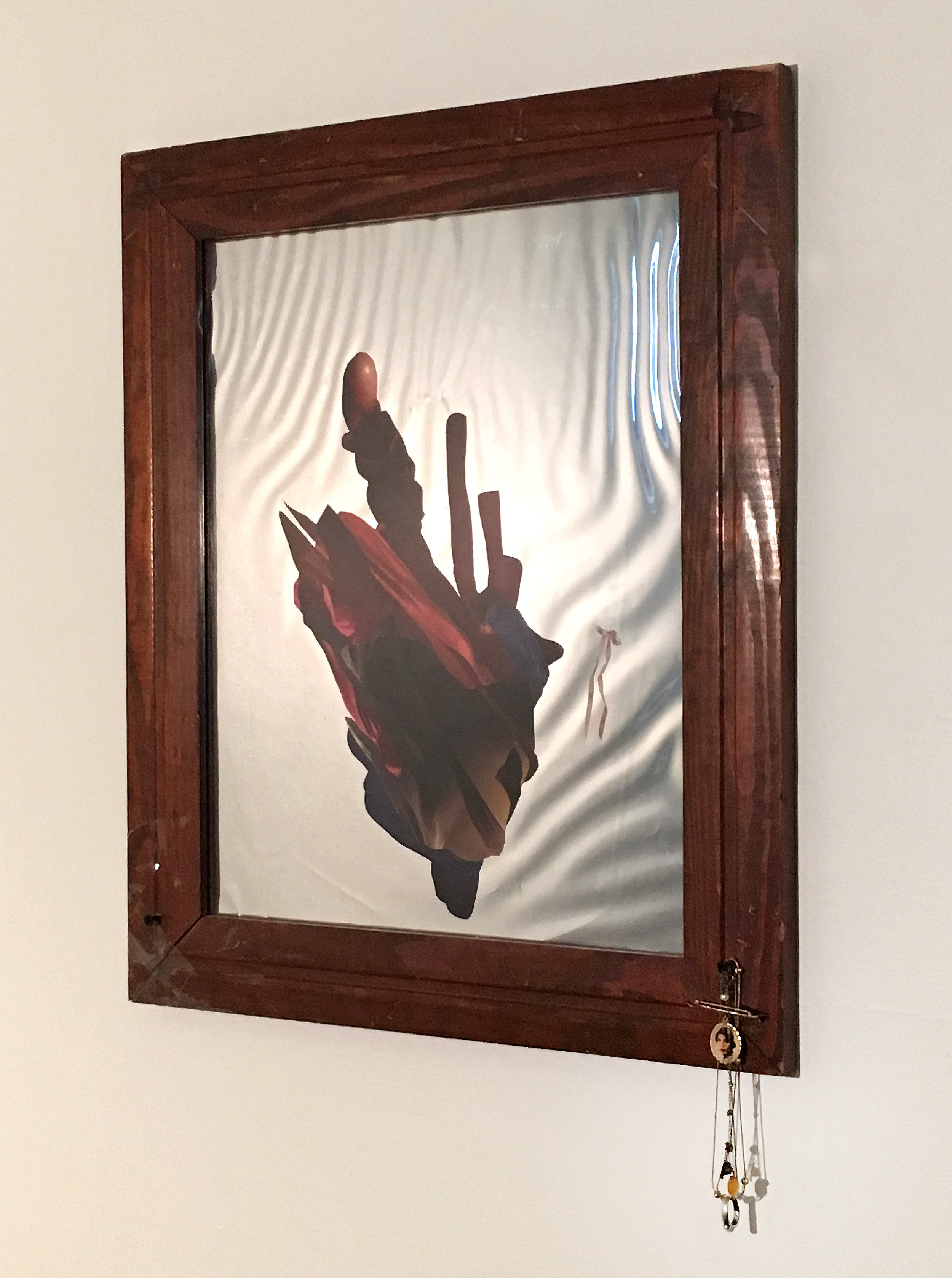   Tongue Tied, 2017    Hand-cut and assembled found images, self produced photographs, mirrored acetate, plexi, found wood frame, sterling silver and gold family heirlooms (with opal, pearl, and citrine)  24 x 20 ½” 