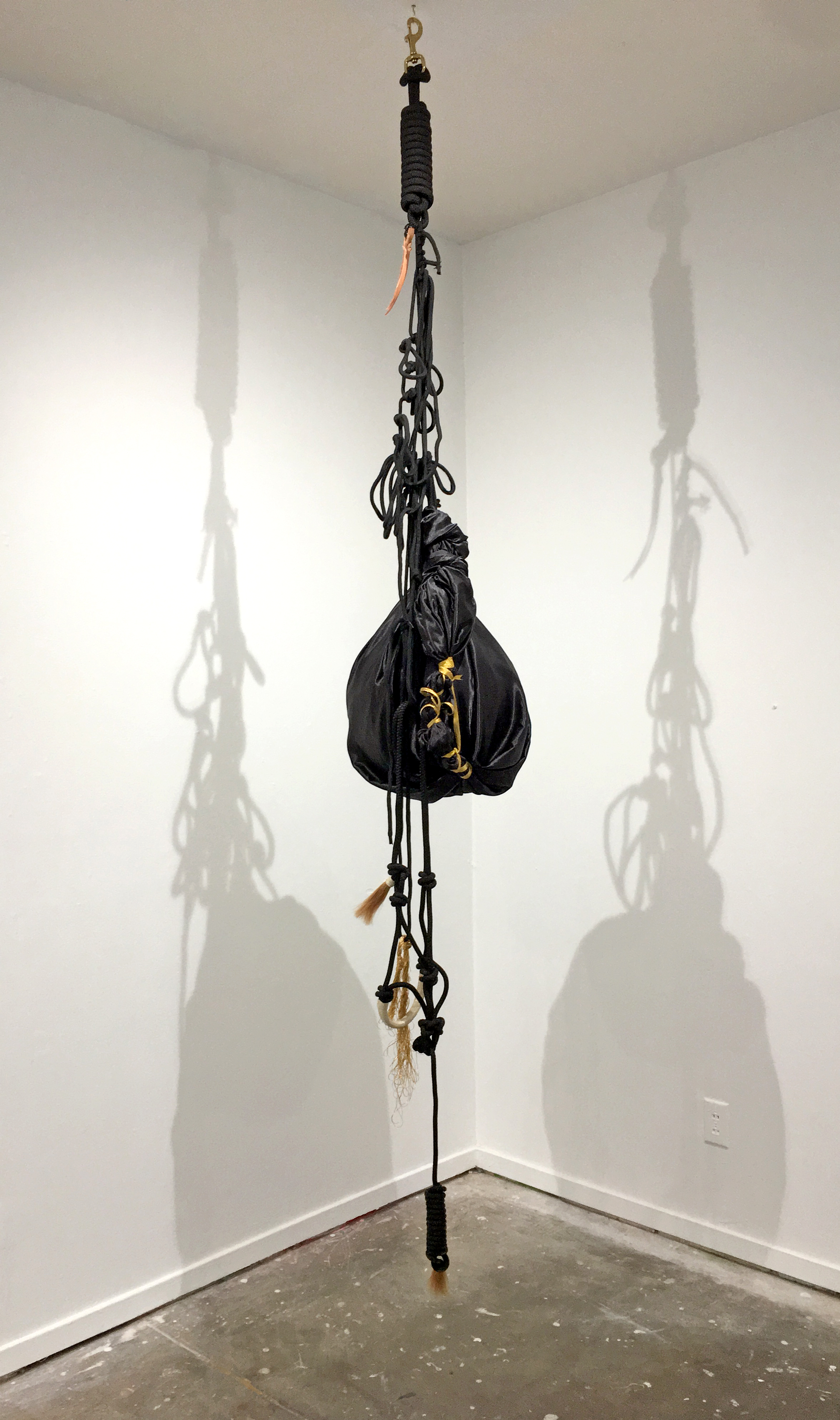   Blue Black, Benighted,   2018, Satin, horse harness, ribbon, rope, beach ball, Dimensions variable 
