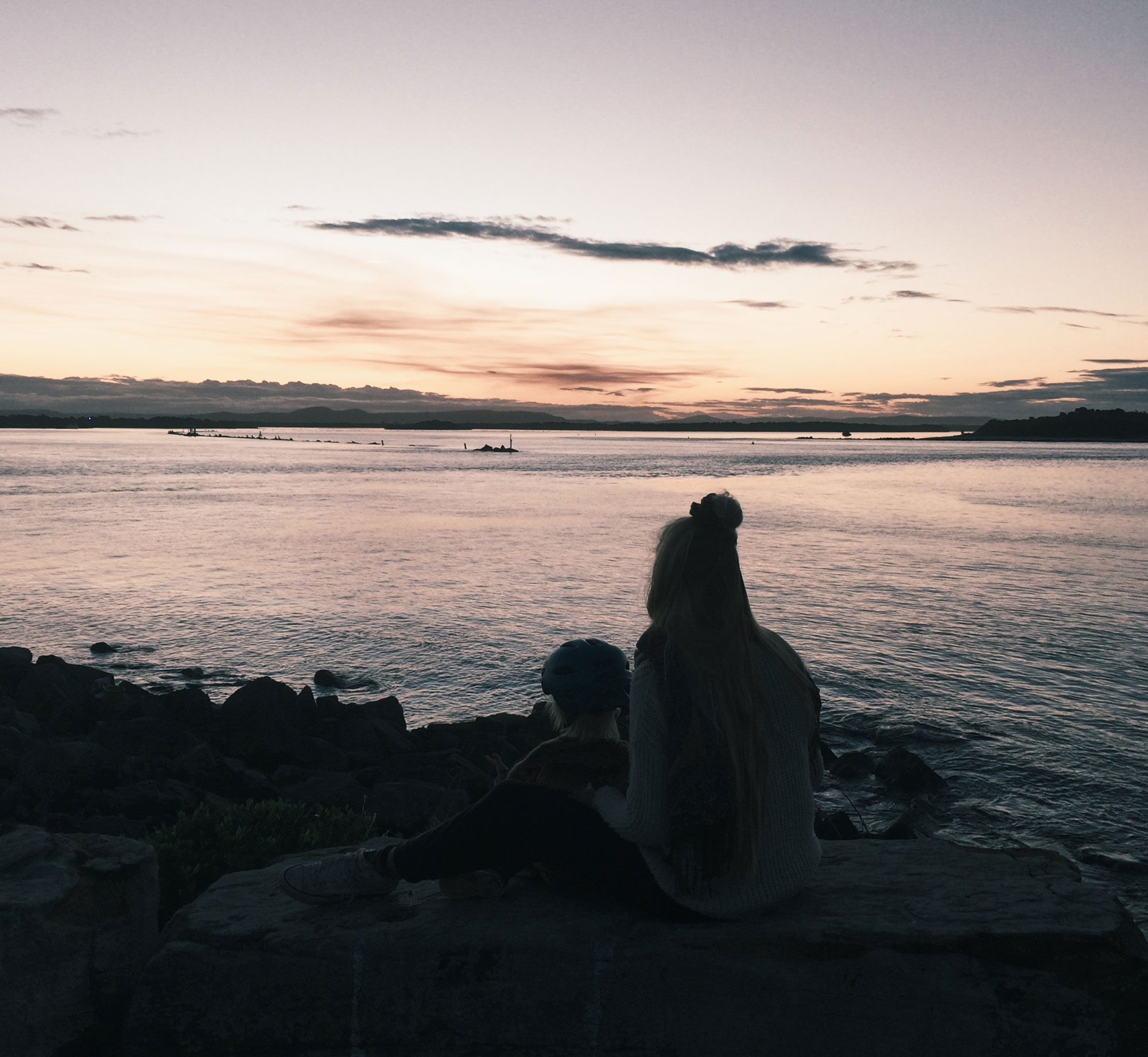 Watching the dolphins playing as the sun was setting in Yamba, NSW.