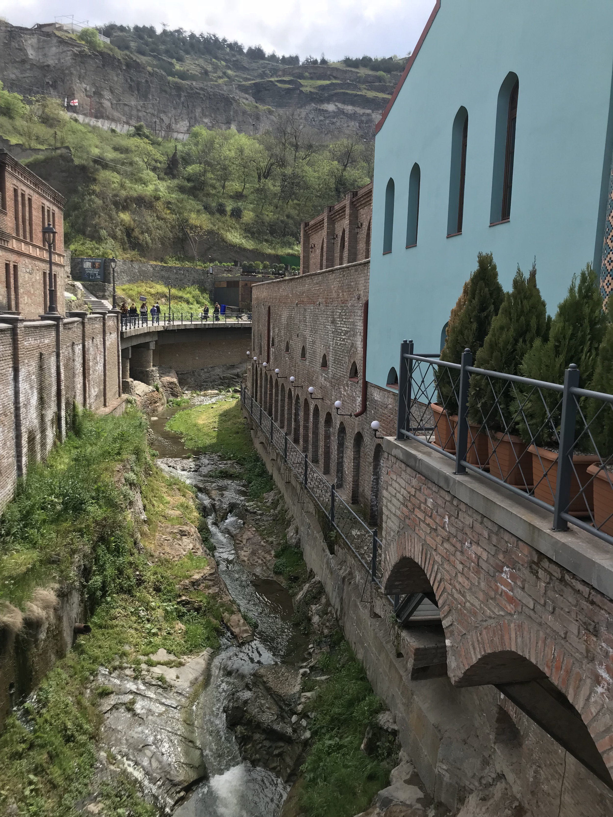 The hot water spring weaves between buildings