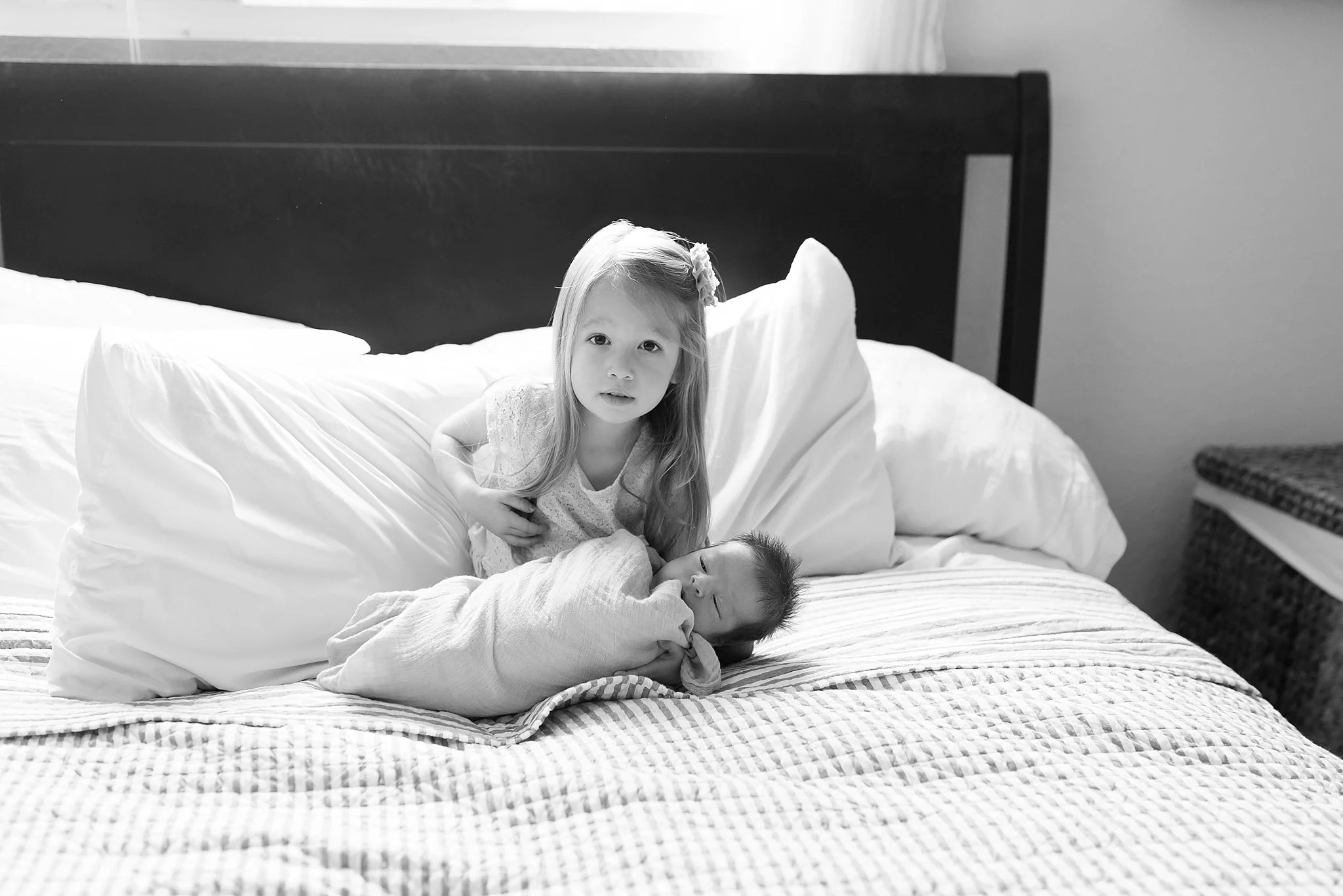  The first time she held her baby brother.