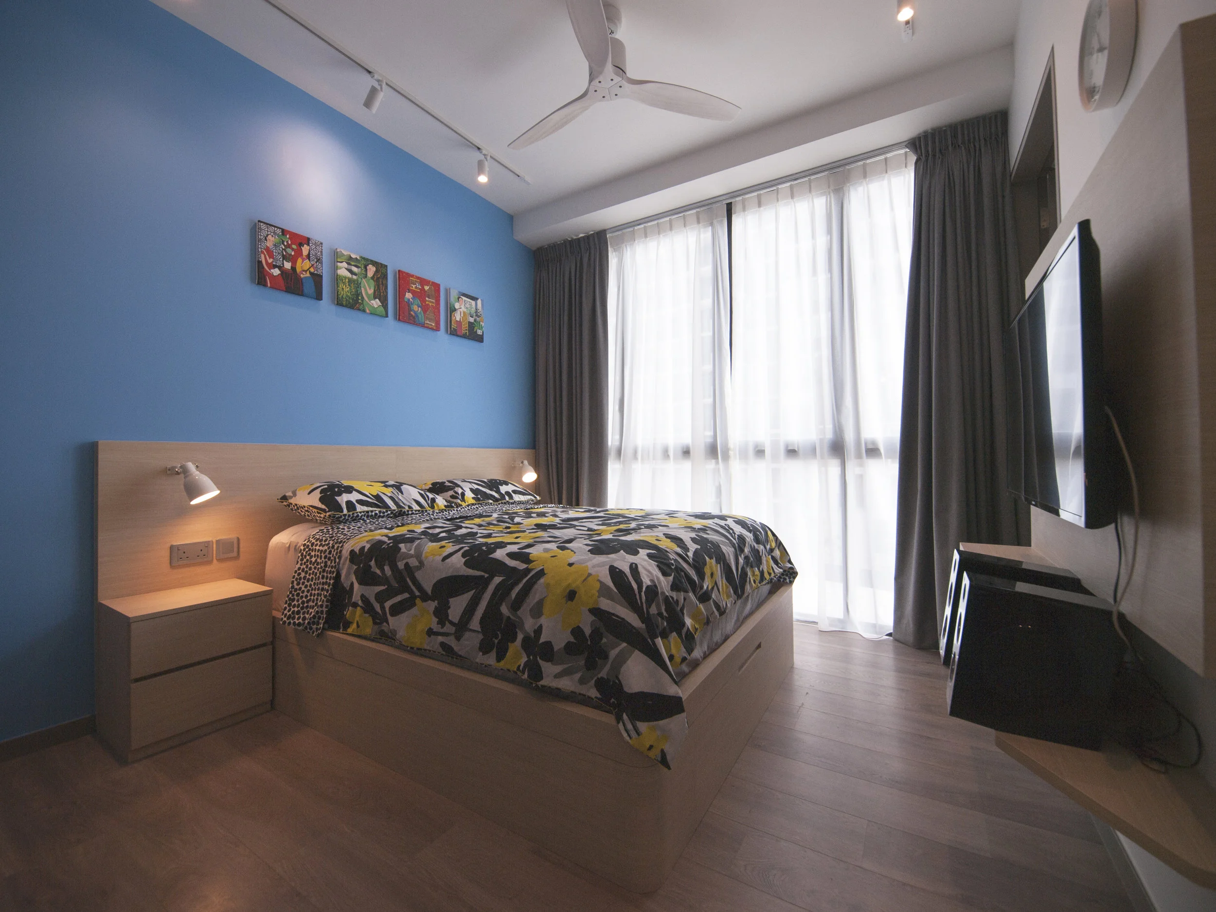 Master Bedroom with bespoke lift-storage bed and slim TV console.