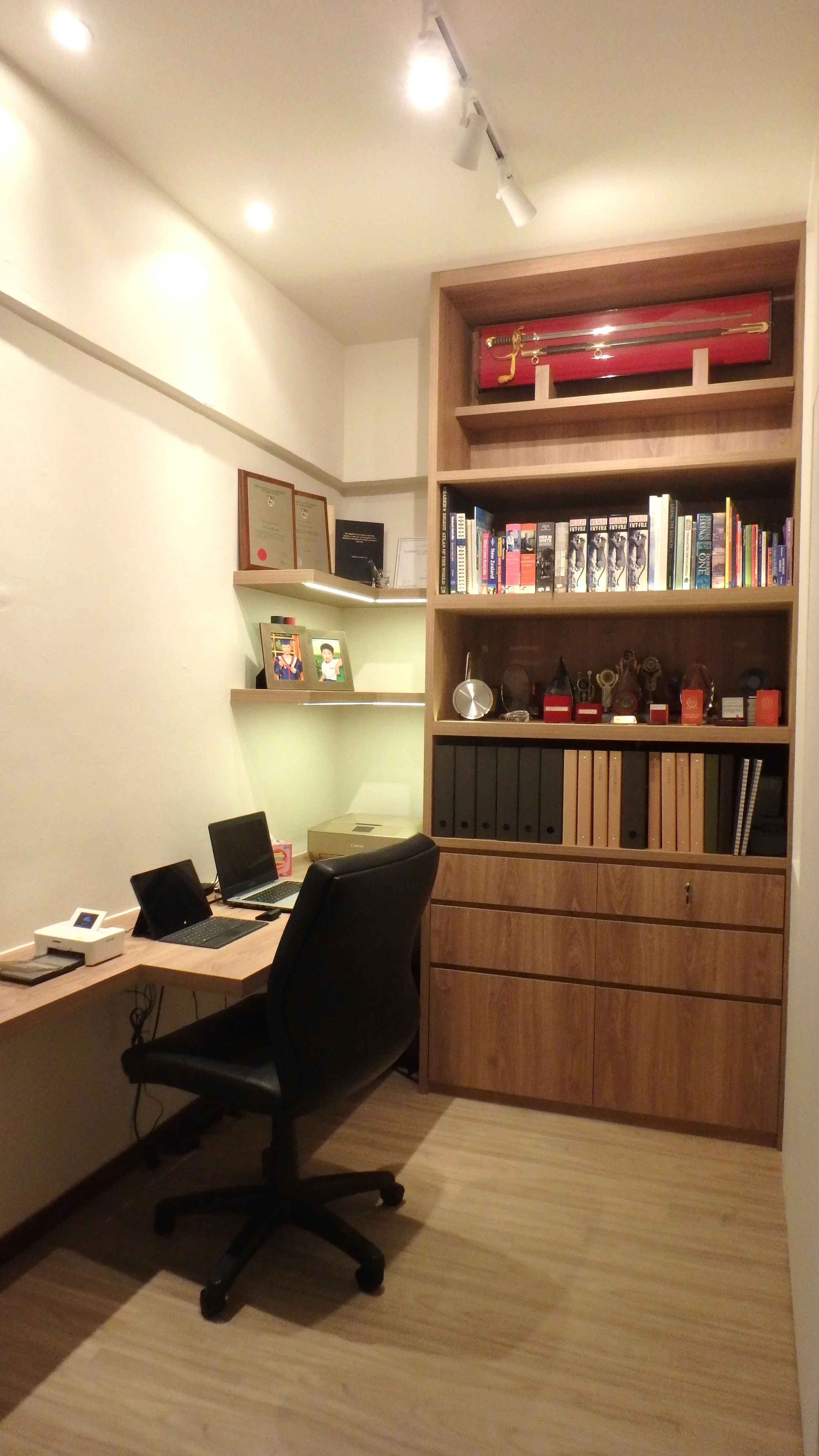 Clever space planning to convert the small utilities room into a Study with sufficient space for a desktop, printer, display shelves and books of higher learning for the two doctors.