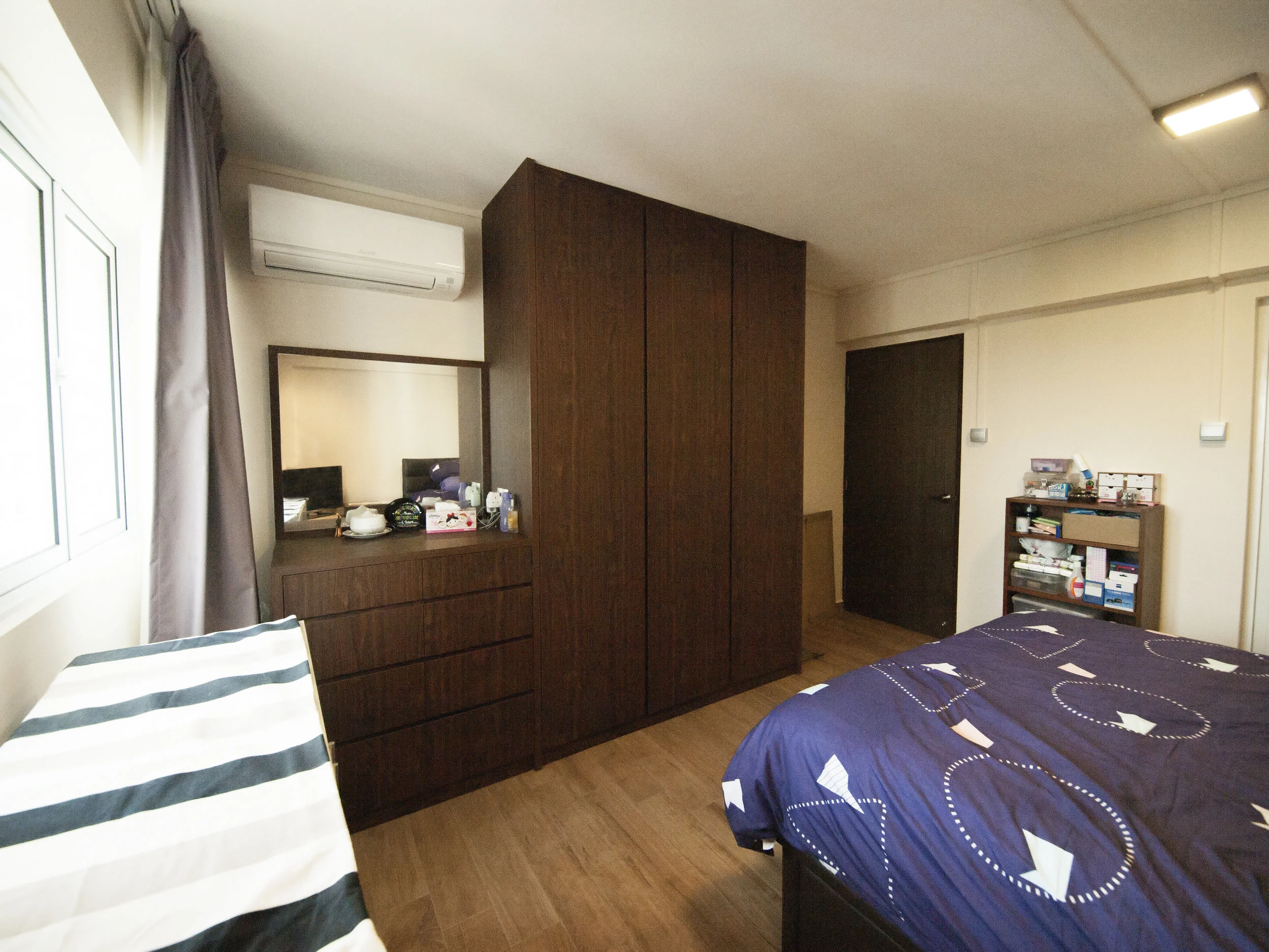 A standing dresser and wardrobe combination.