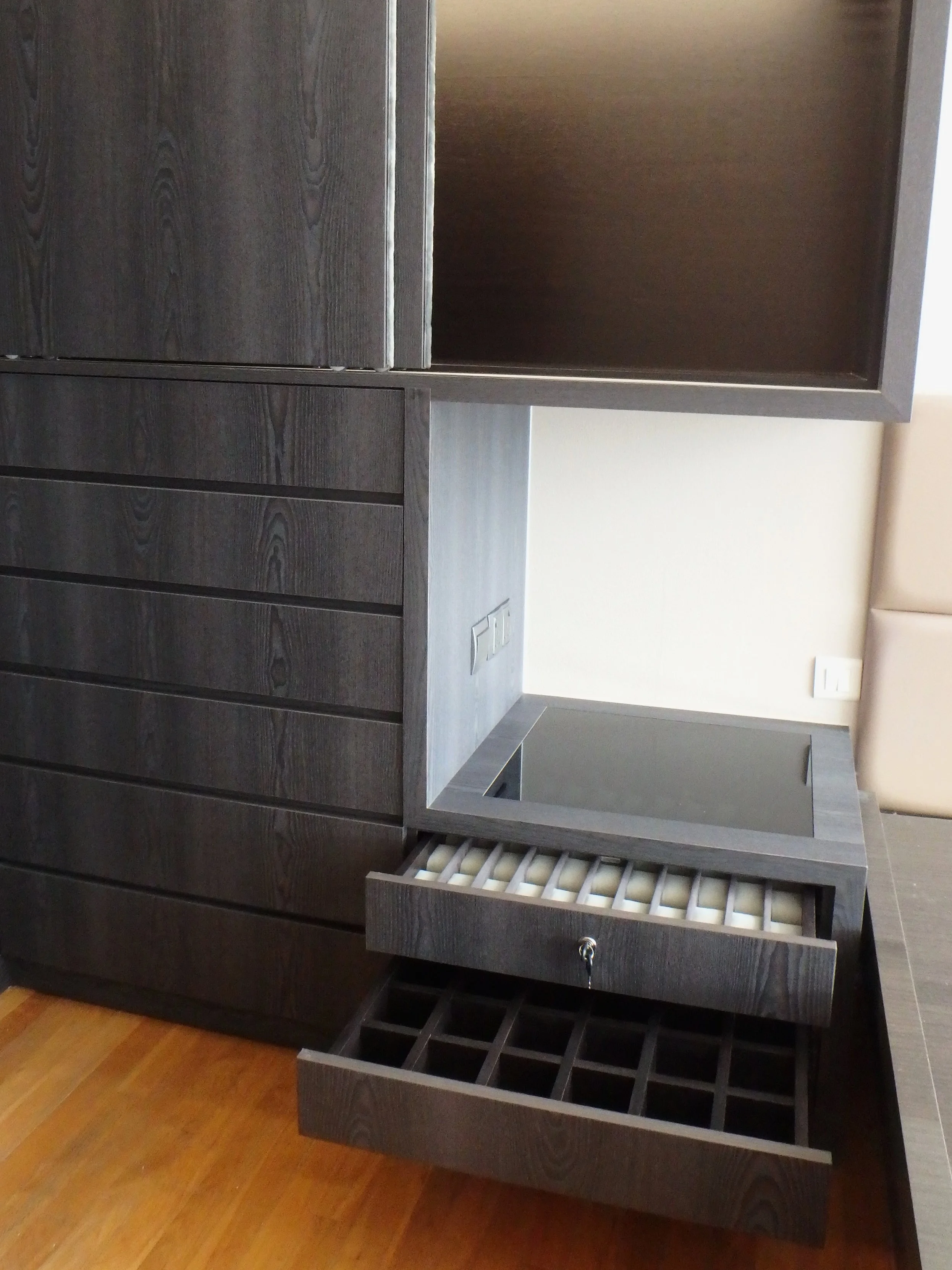 HIS A nightstand with ample space for a watch collection and accessories. The columns of watch cushions can be easily removed and used for belt/accessories storage instead.