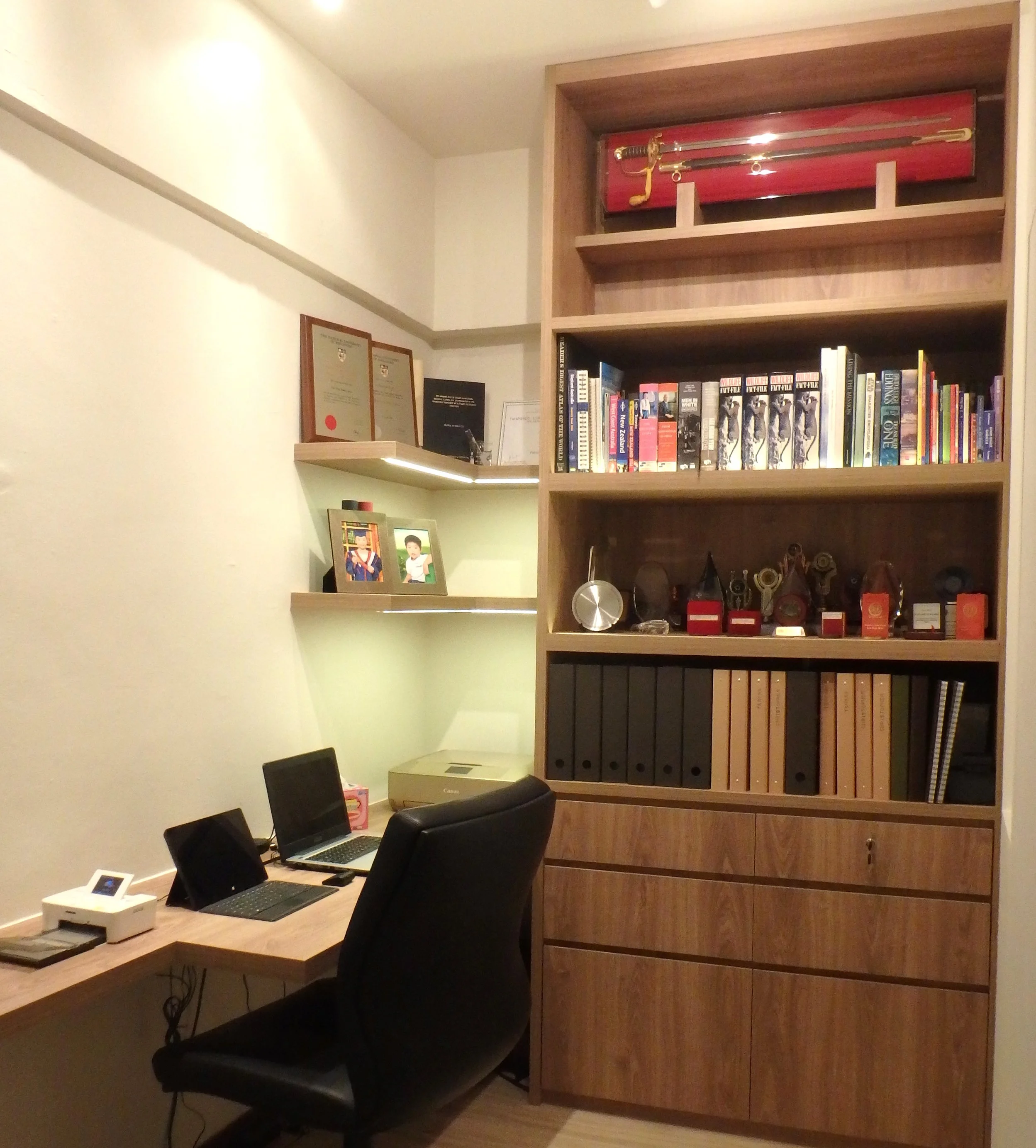 Clever space planning to convert the small utilities room into a Study with sufficient space for a desktop, printer, display shelves and books of higher learning for the two doctors.