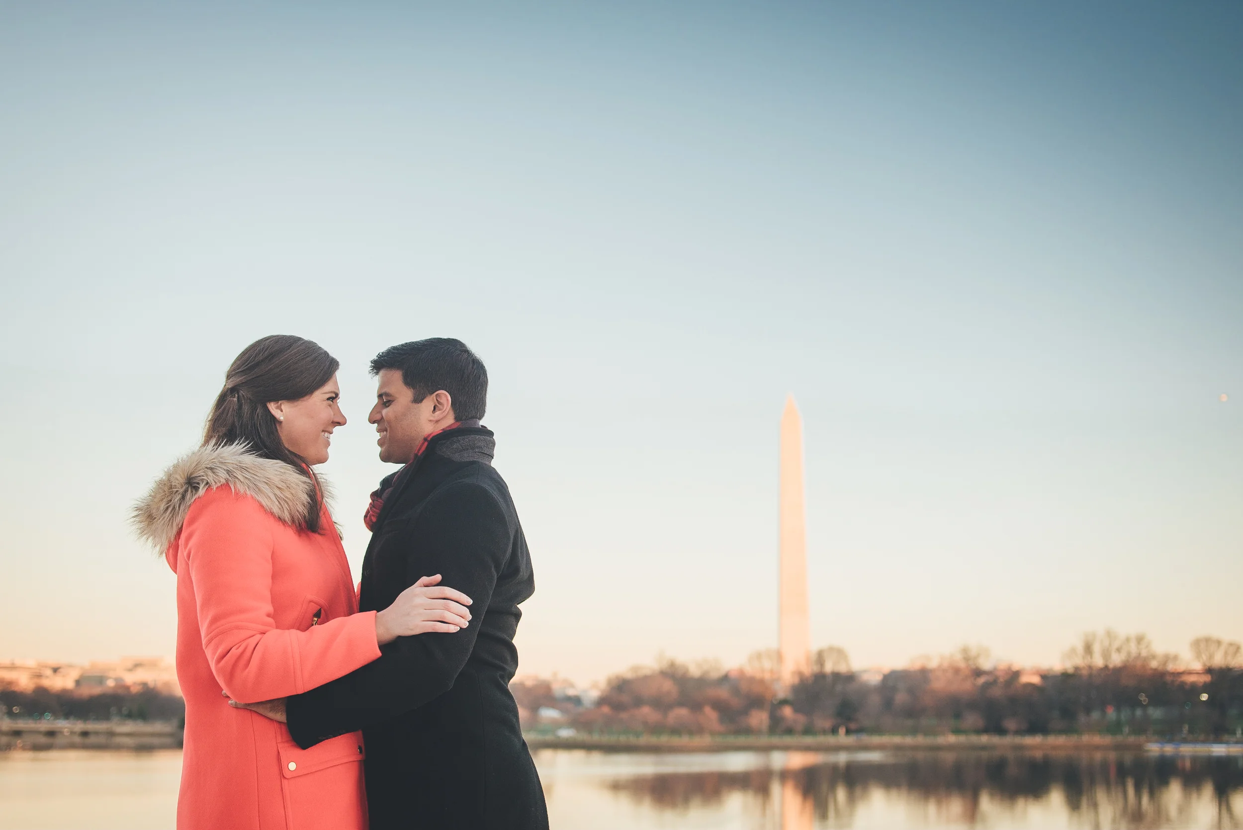 Joe & Christina embrace for an engagement photo on a cold January morning in Washington DC.