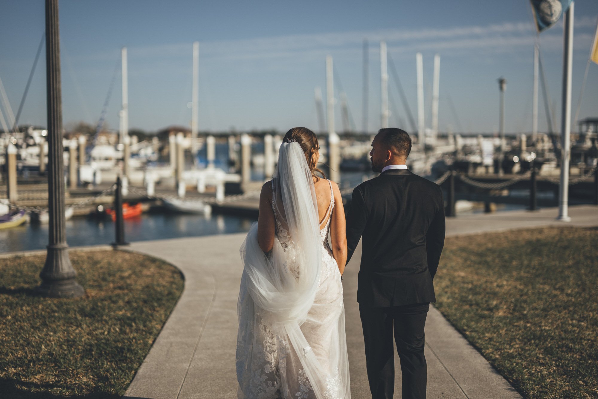 Bow Tie Photo & Video couple admiring each other at waterfront St. Augustine, Florida following wedding ceremony for bridal portraits.jpg