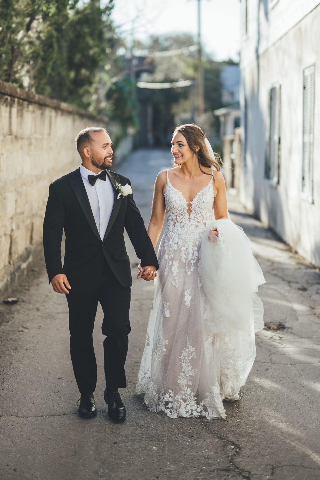 Bow Tie Photo & Video couple admiring each other in alley in St. Augustine, Florida following wedding ceremony for bridal portraits2.jpg