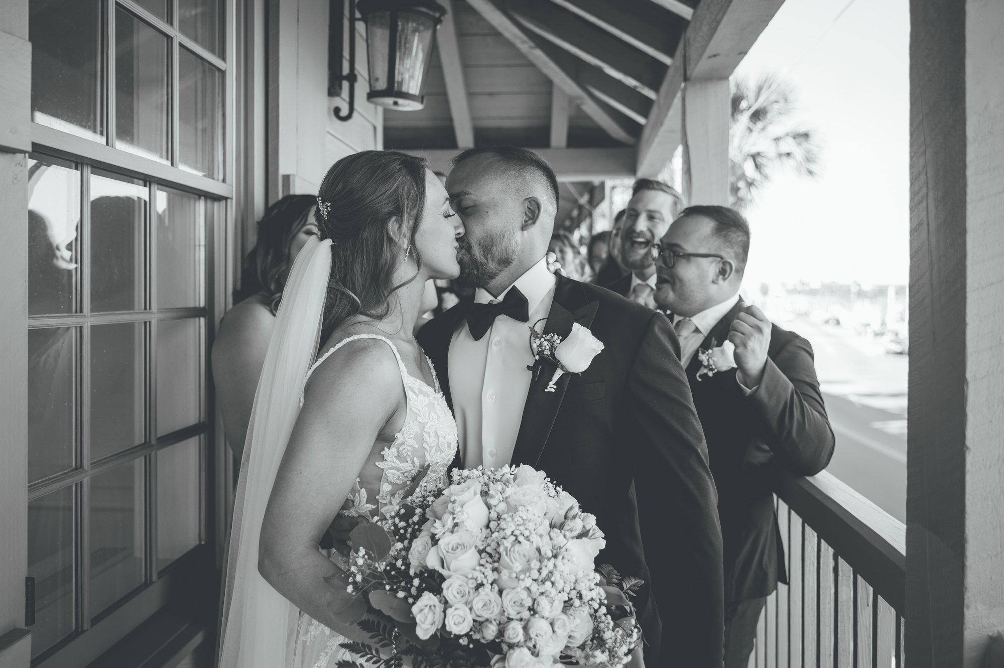 Bow Tie Photo & Video couple kissing outside of The White Room in St. Augustine, Florida after wedding ceremony.jpg