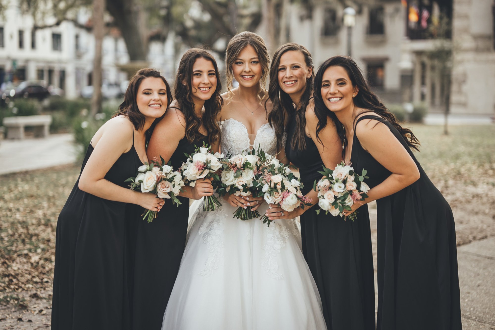Bow Tie Photo & Video bride with her bridesmaids for bridal party photos at Treasury on the Plaza in St. Augustine, FL.jpg