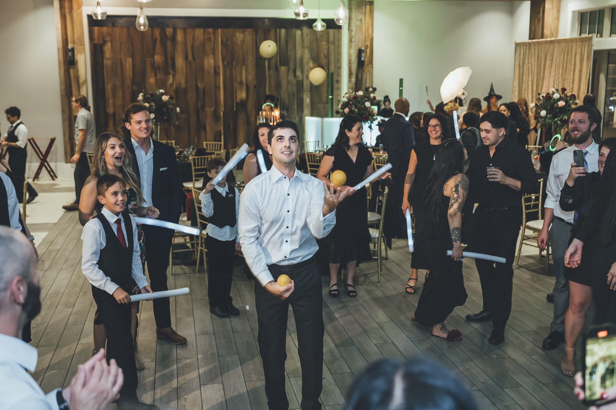 Bow Tie Photo & Video groom juggling on the dance floor in St. Augustine, FL.jpg