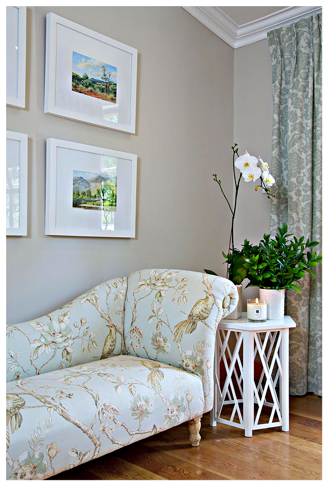 White boxed framed art brings a fresh contemporary element to the more traditional custom made chaise.