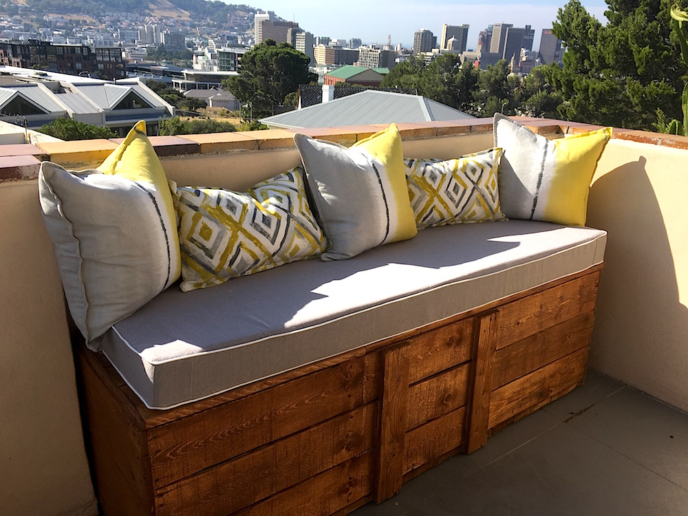 A wooden bench adds loads of seating in a tone and style that works with the existing tile work.