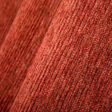 CHENILLE | A fuzzy, caterpillar-like yarn of either cotton or man-made fibres, produced by locking short, cut fibres at right angles to the core thread. Fabric woven with chenille yarn in the weft, producing a cut-pile surface.