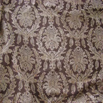 JACQUARD | A complex method of weaving making use of punched cards to control each warp yarn individually. This enables elaborate designs to be produced with no limit on the size of repeat design, e.g. brocades.