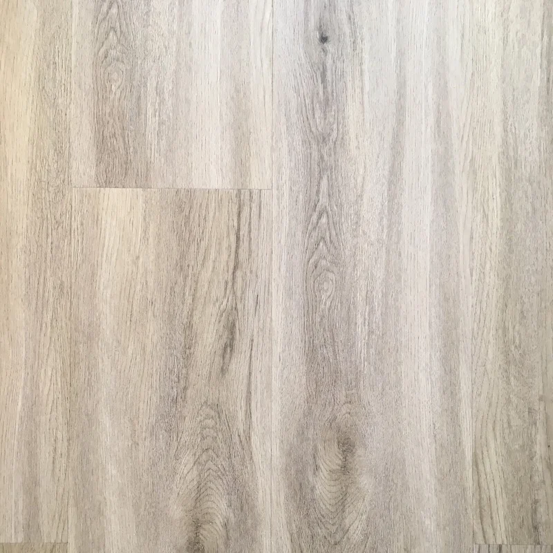 A laminate floor replaced stained carpets, adding a modern, light finish that is easy to clean and maintain. Laminate flooring provides a budget-friendly alternative to real wood floors.