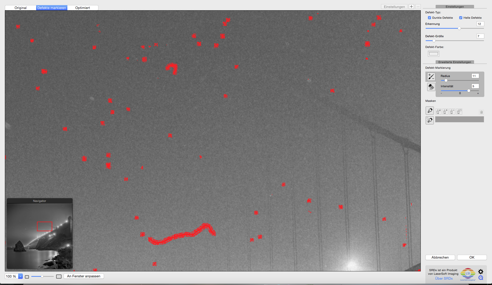 With a "Detection" setting of 12 and a "Tile Size" setting of 7, we get rid of real defects and do not target fine detail in many parts of the image.