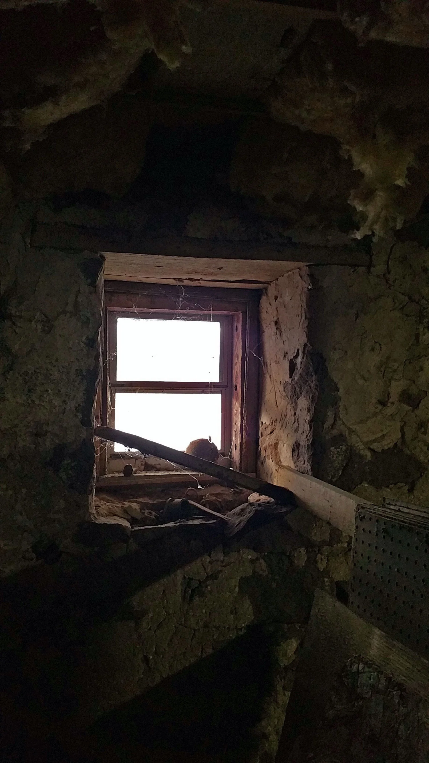 Detail of window set in original stone wall