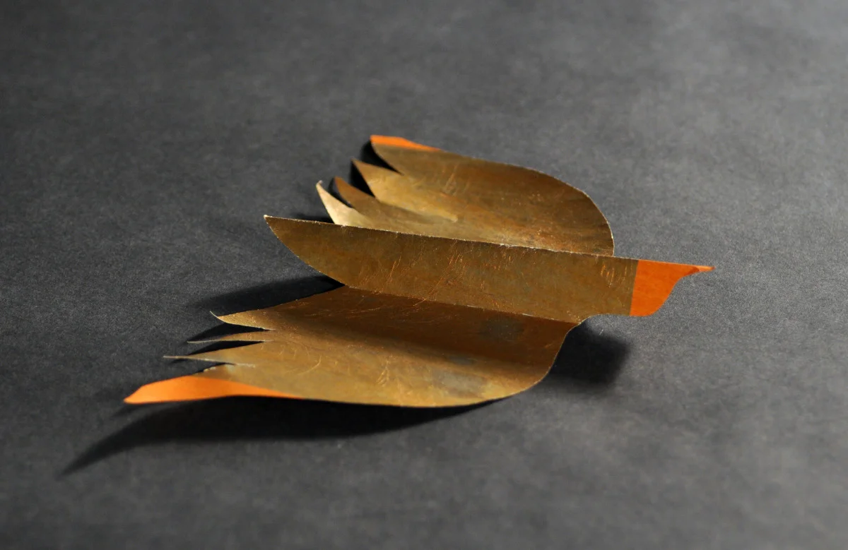 A paper bird representing physiological comfort.