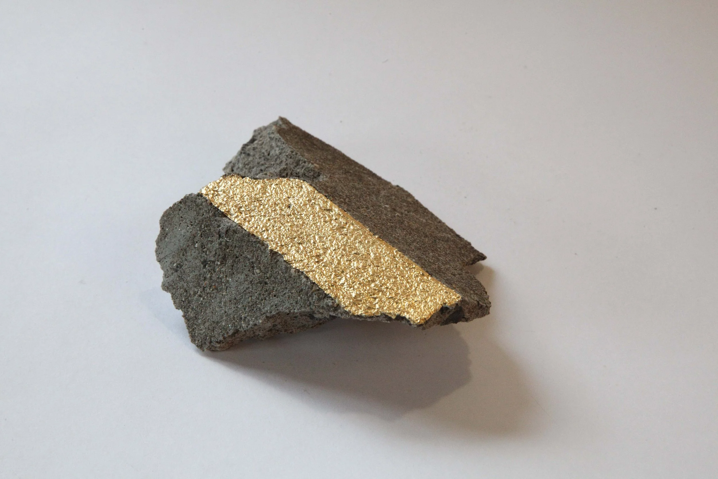 (c)Gilbert_SS.18, 2017. Found asphalt and gold leaf..jpg