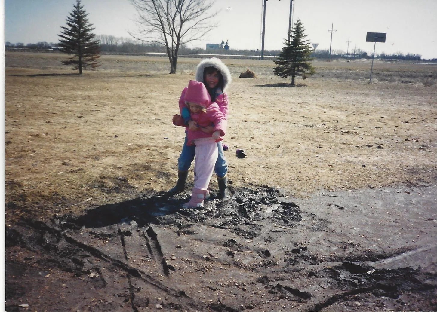 My younger sister Megan and I panicking, trying to get out of this sticky mud... and Mom just happened to have the camera?