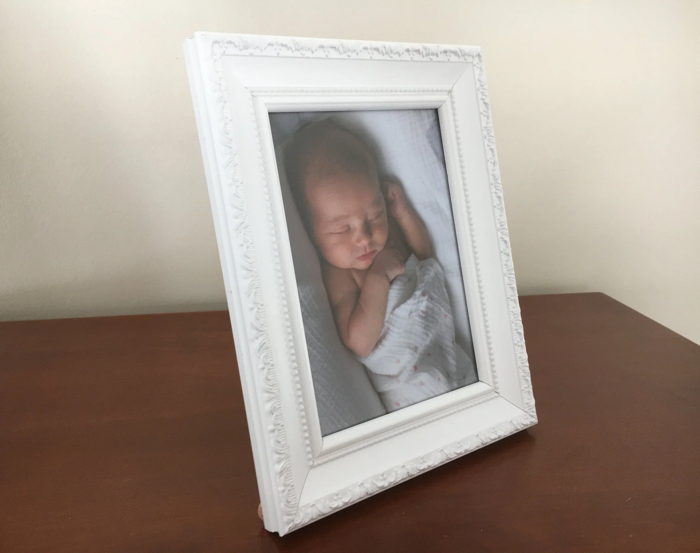 Keepsake's 'siena' frame in white, 5" x 7". This is the photo we used on Ginny's birth announcement. I ordered two of these frames - one for each set of grandparents. Cost - $29 each.