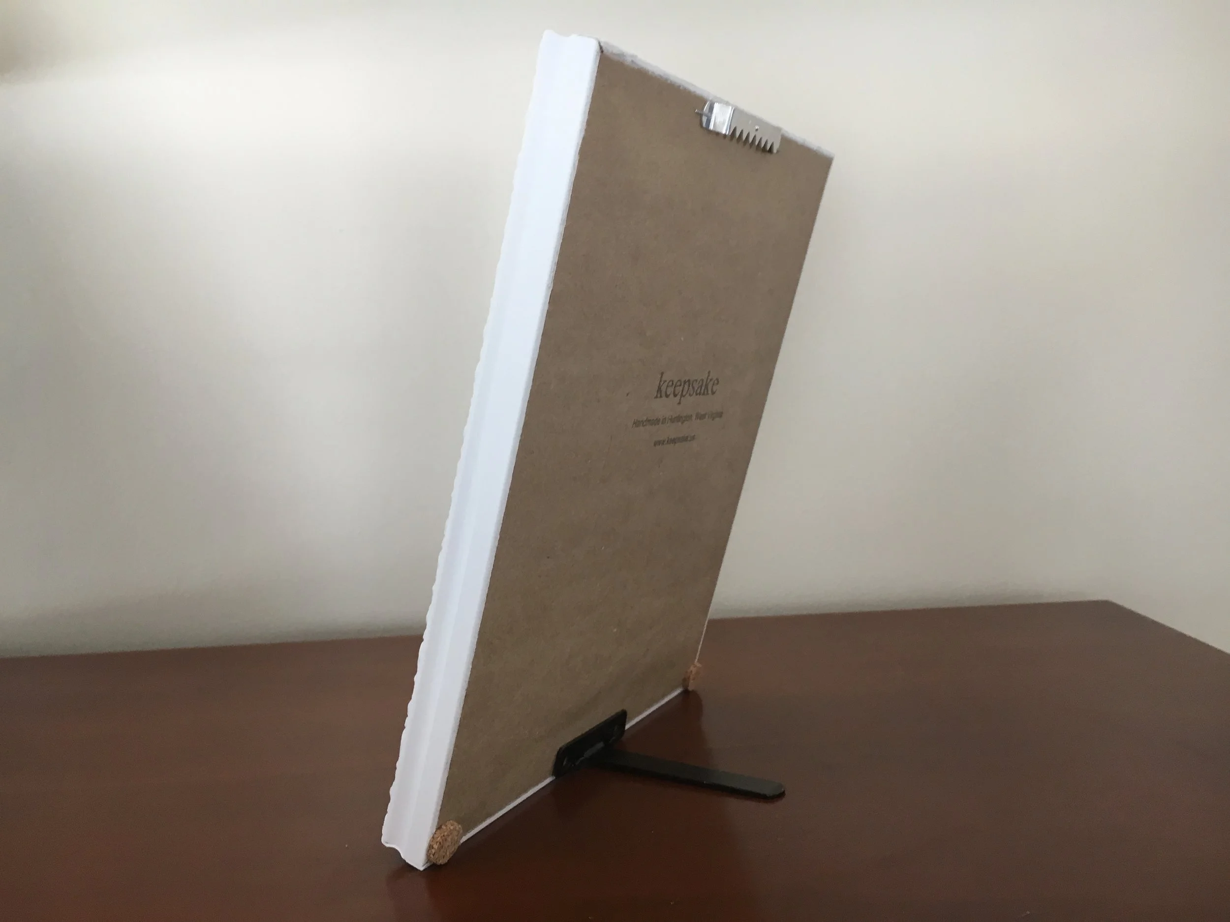 Back of the 'siena' frame. Pros = sturdy hanger hardware is pre-mounted + little cork bumpers are included to protect your walls. Con = the stand attachment for table display comes off too easily.