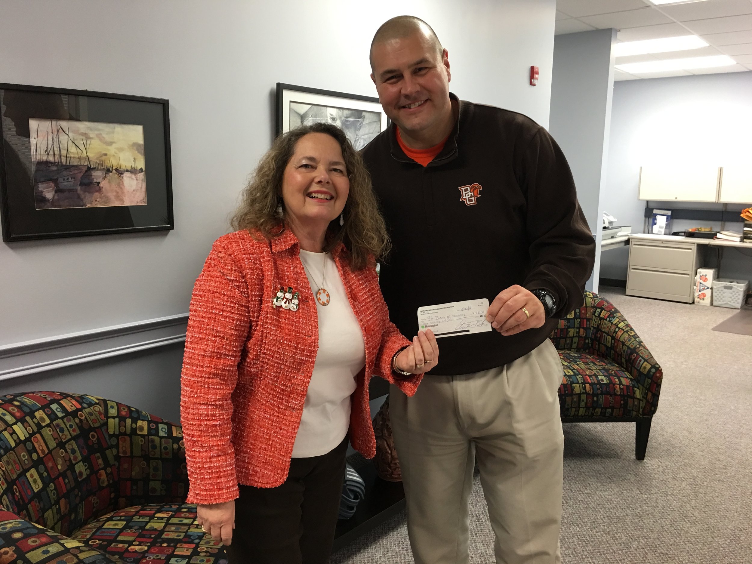 Cal Bowers, President of BGCF presenting a check to Rhonda Melchi, Treasurer of Bowling Green City Schools.