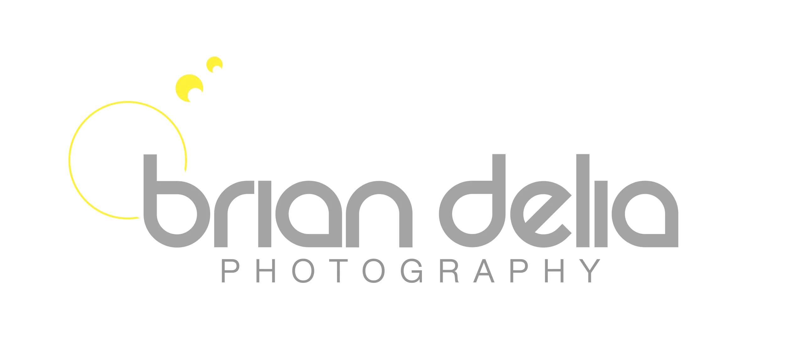 Logo for Brian Dela Photography with stylized yellow crescent moons and circles.