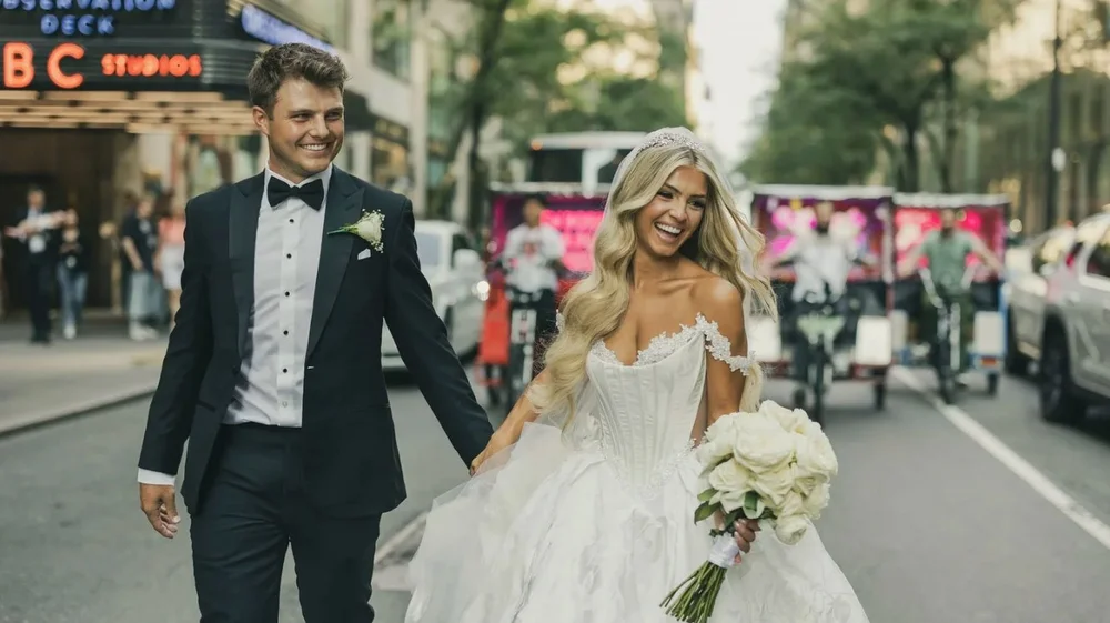 Couple running down a NYC street, Rainbow Room wedding