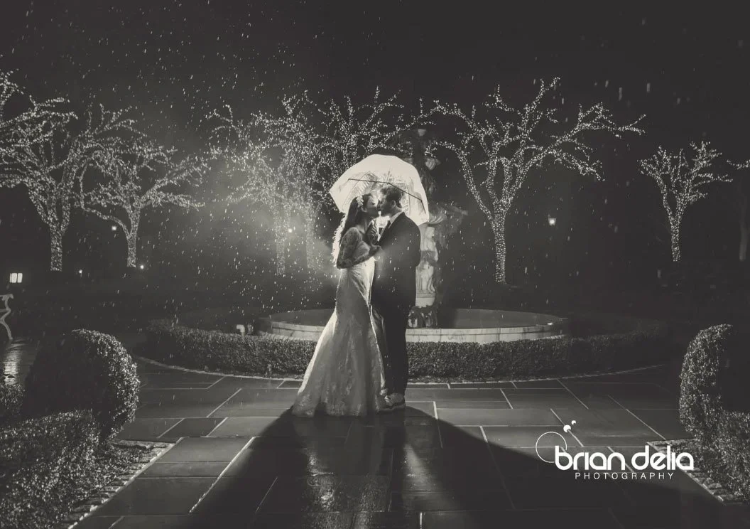Night wedding film still, bride and groom in the rain at Park Chateau