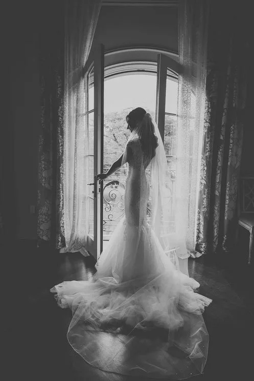 North Jersey Wedding Photographer Brian photographed a bride silhouette in the doorway at Park Chateau in black & white.