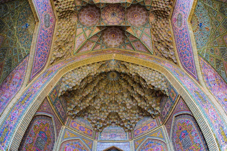 Wealth accumulated (and art crafted) in the name of religion. The magnificent mosque gate at Shiraz, Iran. Pic by Steven Su .